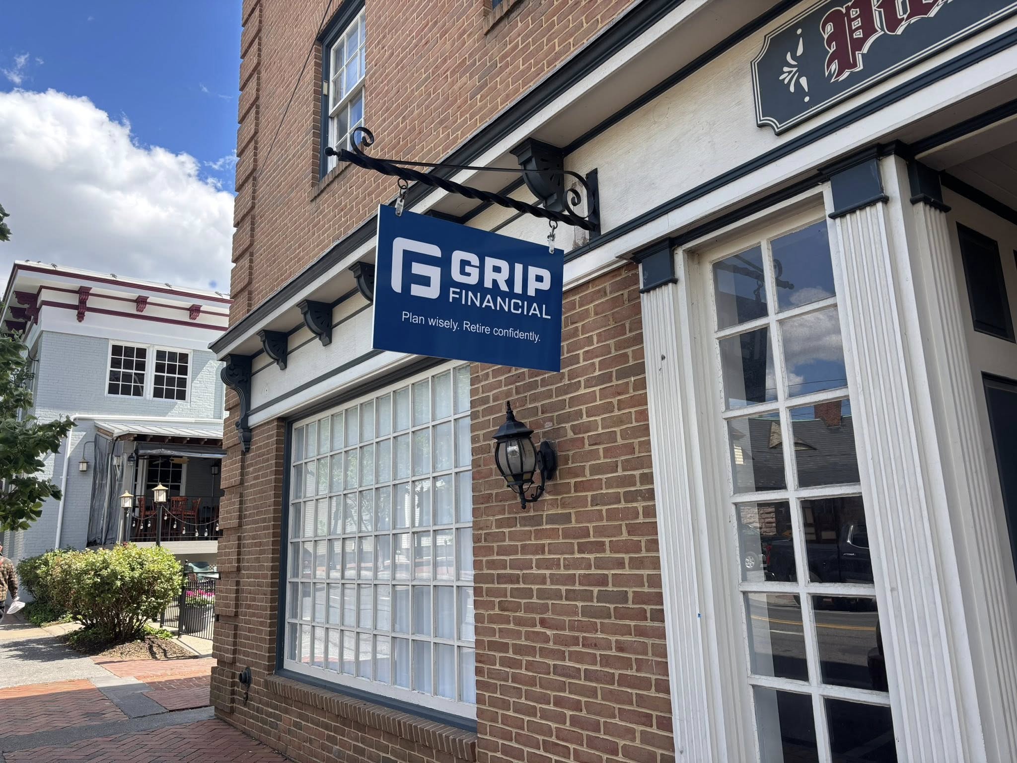 Custom hanging blade sign for Grip Financial in downtown Winchester VA