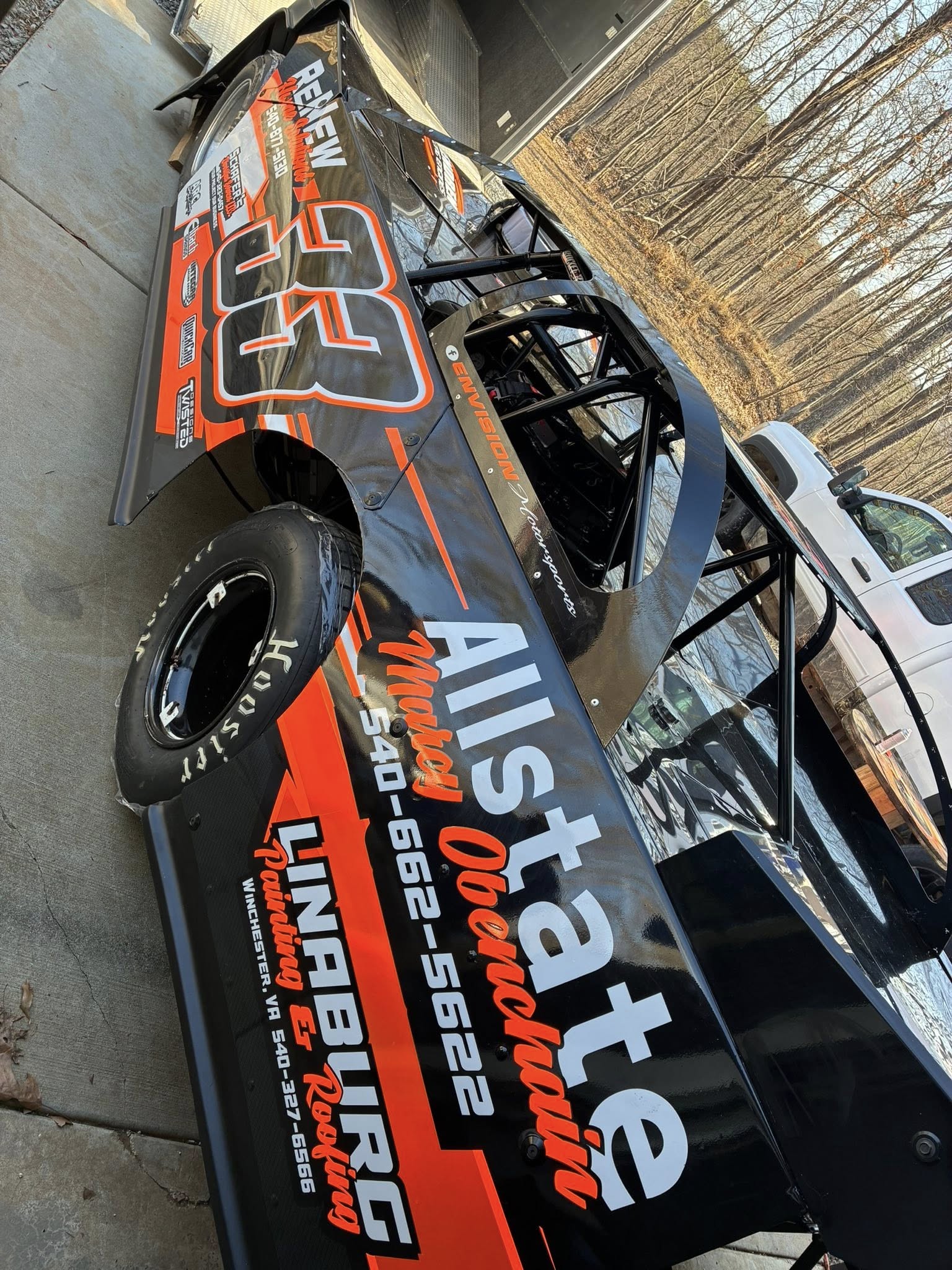 Custom race car wrap with sponsor graphics by Winchester Signs and Vehicle Wraps
