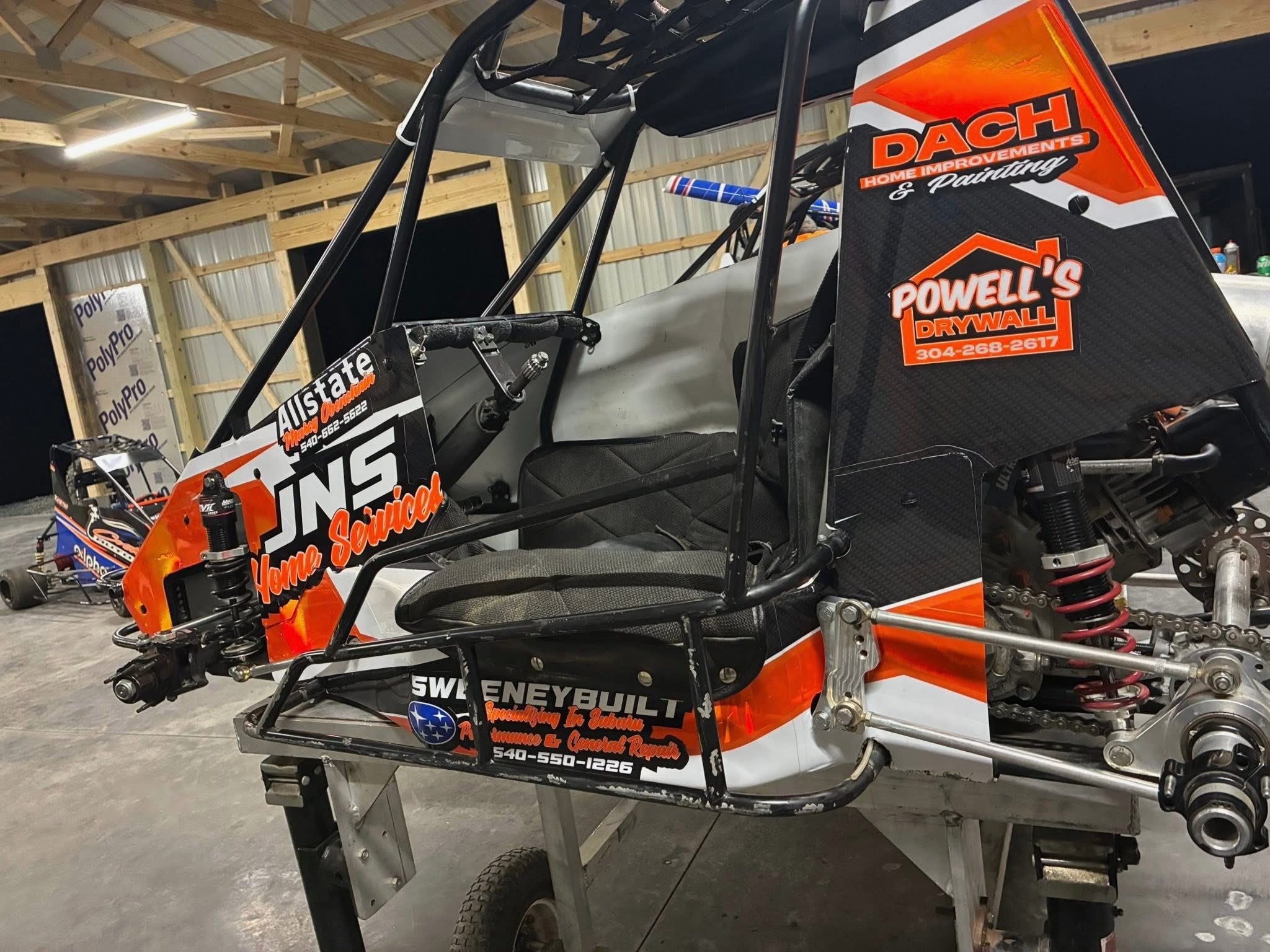 Custom sprint car wrap with multiple sponsor graphics by Winchester Signs