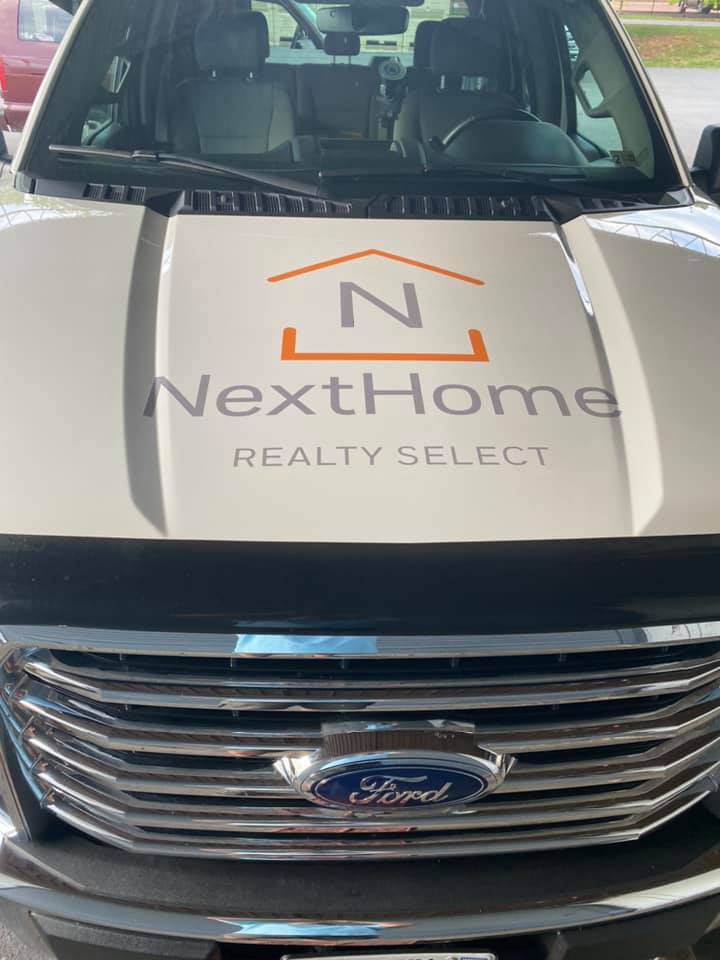 Hood wrap with NextHome Realty Select logo on Ford F150 by Winchester Signs
